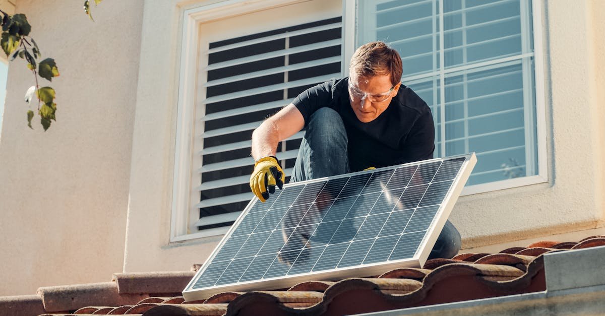 Solar technician installing a photovoltaic panel on a rooftop, promoting renewable energy.